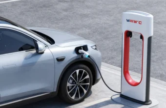 Modern electric vehicle charging at a public station in a city