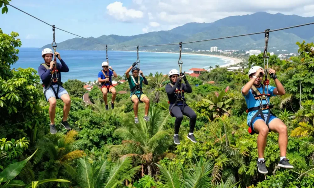 A diverse team of young professionals enjoying outdoor team building in Puerto Vallarta as they zip-line through the lush jungle canopy with Banderas Bay in the background.