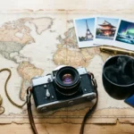 Notebook and map showing how to create a stress free travel itinerary